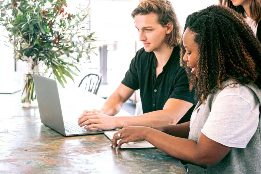 man-working-on-a-laptop-while-woman-takes-notes-3153208 man working on a laptop while woman takes notes 3153208 1