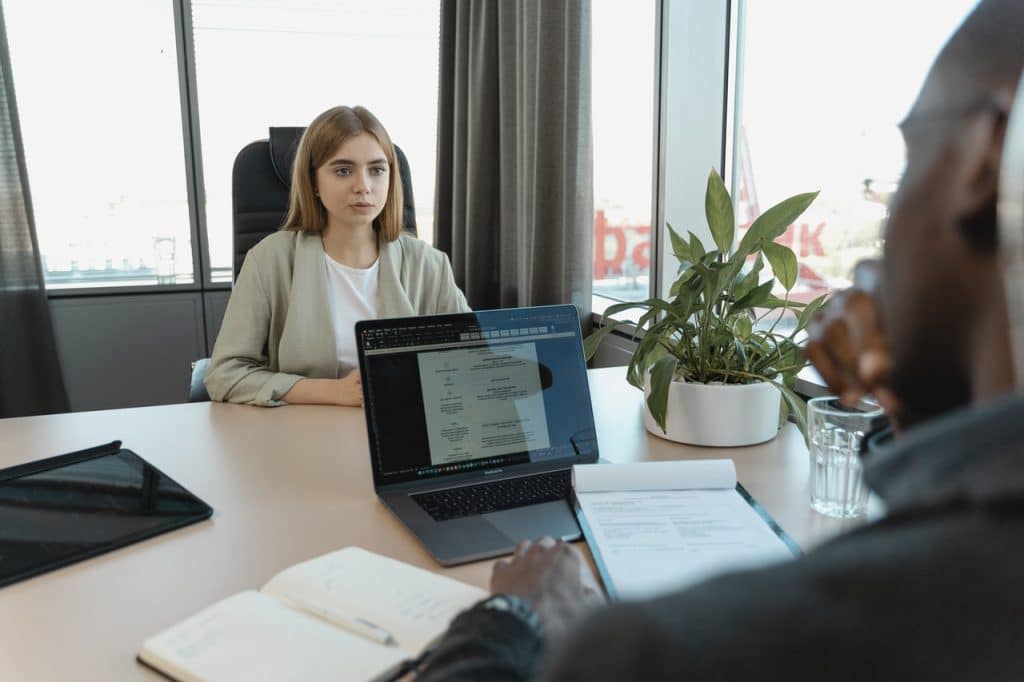 An employeer reviewing the applicant's resume during an interview